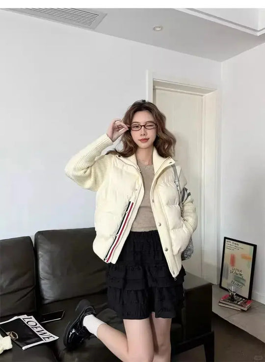 Calidez plumón blanco, costura impecable